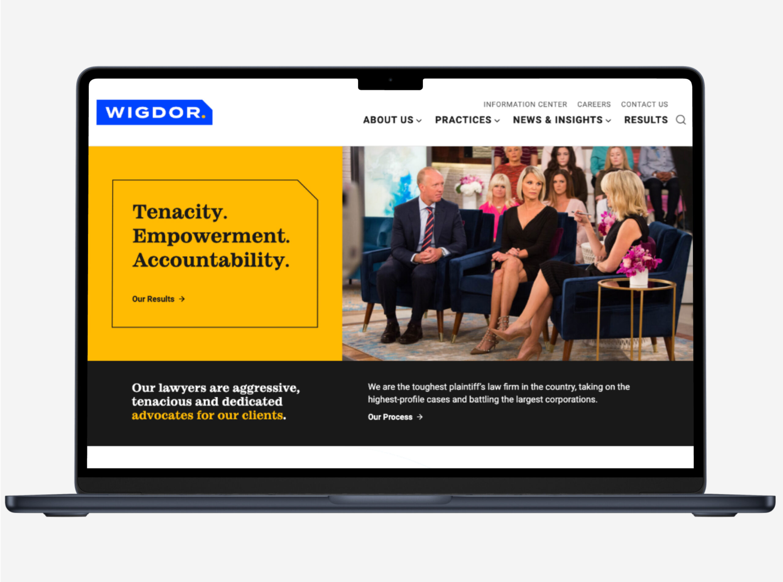 The Wigdor homepage shown on a mock laptop screen.